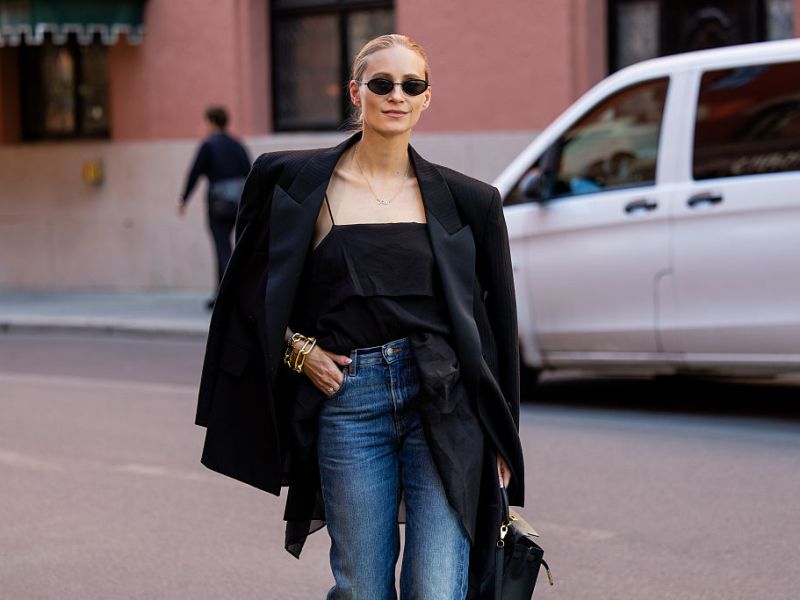 Tine Andrea wears black blazer, jeans, black top Hermes bag during Oslo Fashion Week on August 26, 2025 in Oslo, Norwegen